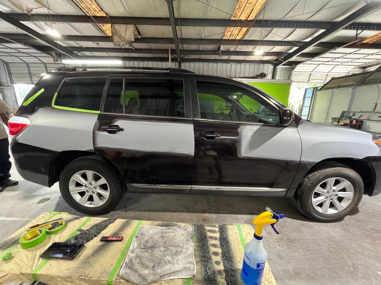 Toyota Highlander paint blending in progress - masking tape and primer visible at The Drip