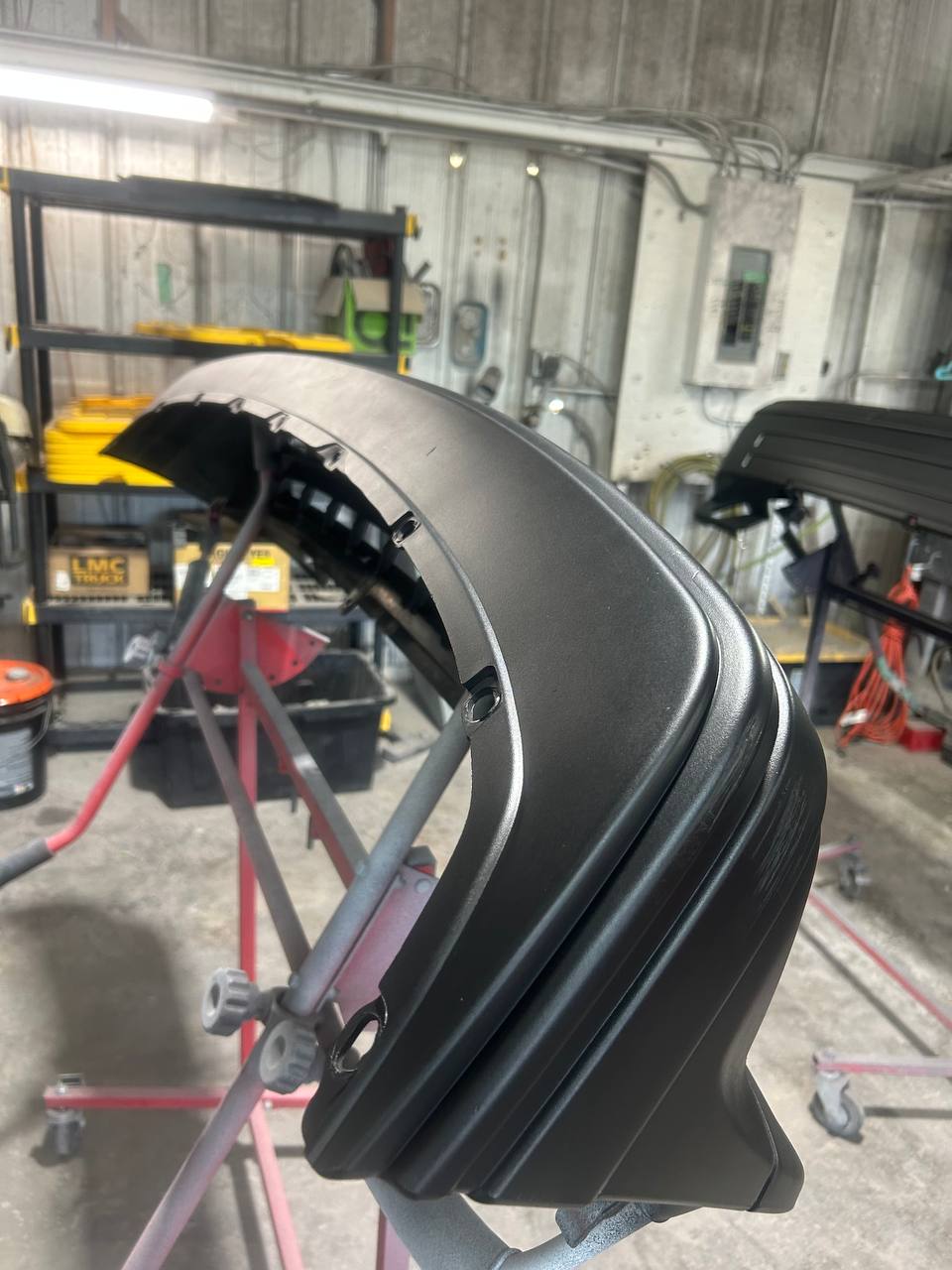 Jeep Wrangler fender flare freshly painted satin black during restoration at The Drip Auto Body Leesburg FL
