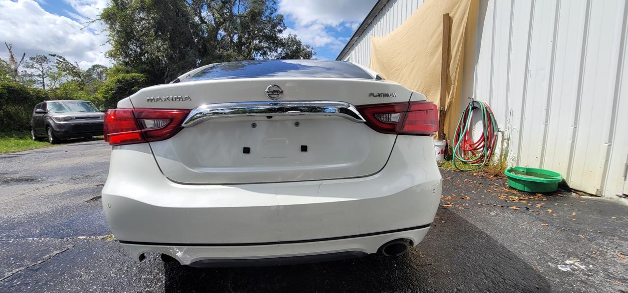 Nissan Maxima Platinum after repair - rear view showing clean trunk and bumper at The Drip Leesburg FL