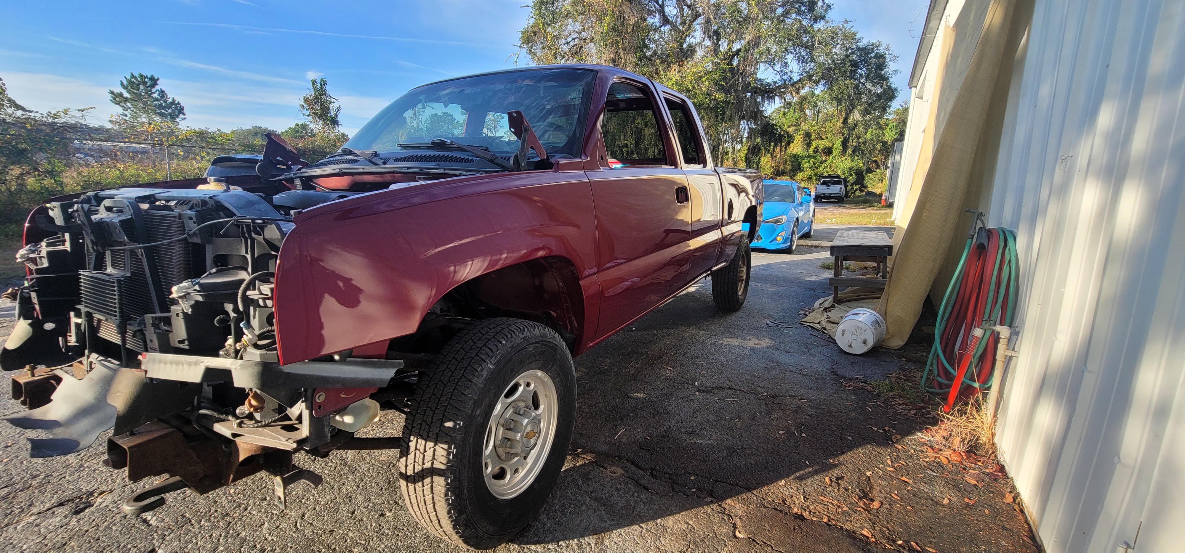 Chevy Silverado front end rebuild in progress - stripped and freshly painted at The Drip Leesburg FL