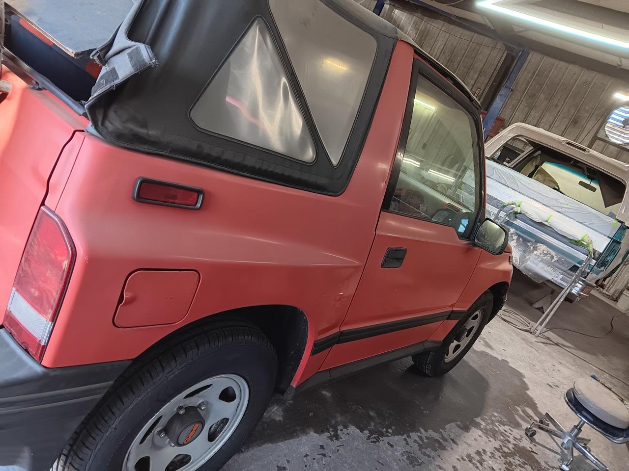 Geo Tracker convertible restoration - rear quarter view with soft top at The Drip Auto Body