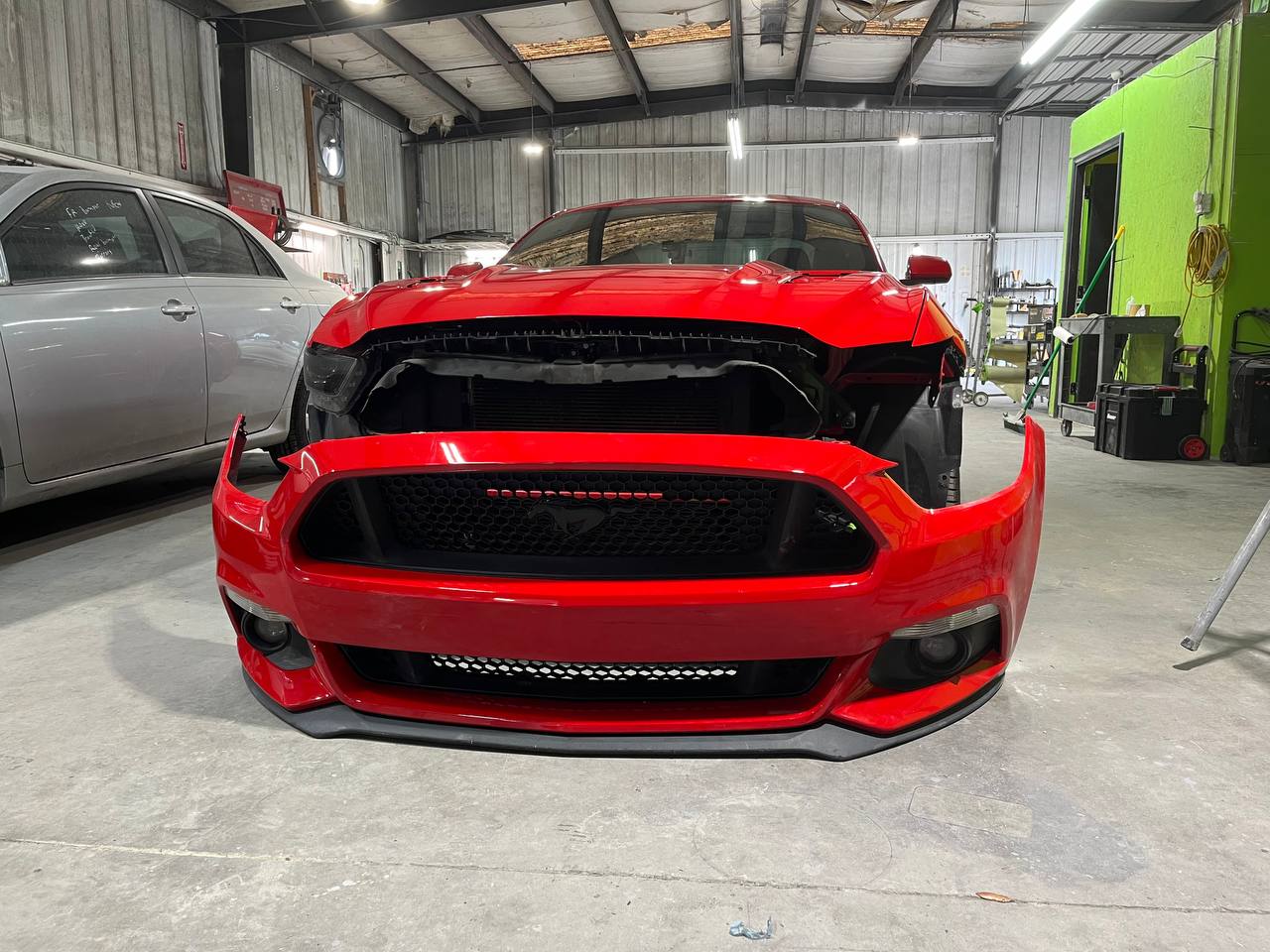 Ford Mustang GT during repair - bumper removed in shop